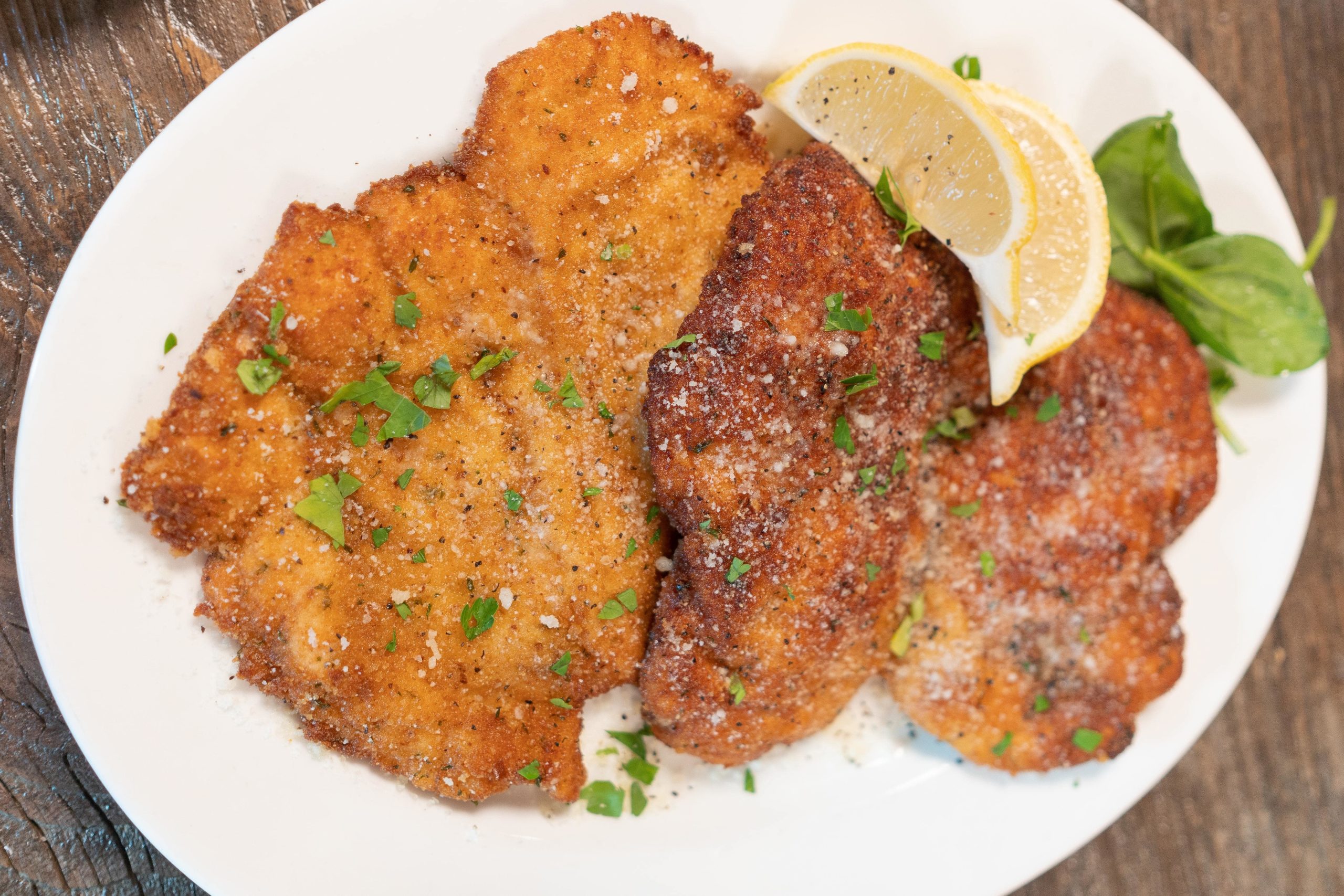 chicken milanese, Pounded, breaded, pan-fried & seasoned to perfection, vegetables & fried potatoes